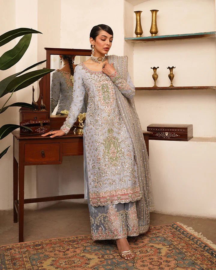 Model wearing Faiza Saqlain Formals Irina Oct '23 Edrina dress in grayish blue, Pakistani clothes online in UK.