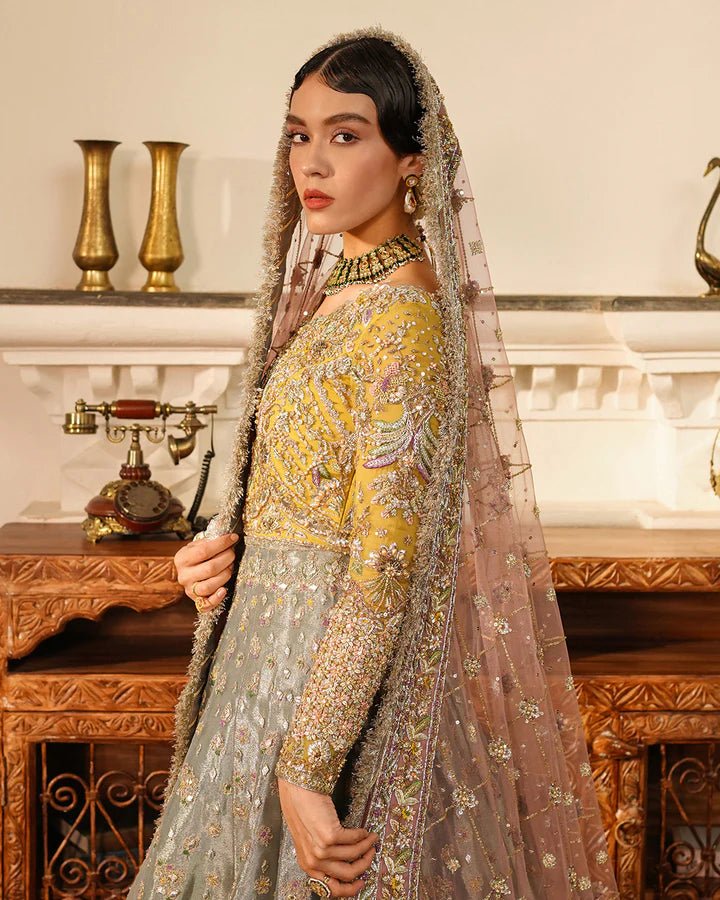 Model wearing Faiza Saqlain Formals Irina Oct '23 Najmeh dress in pastel green, yellow and blush pink, showcasing tradtional Pakistani clothes online in UK.