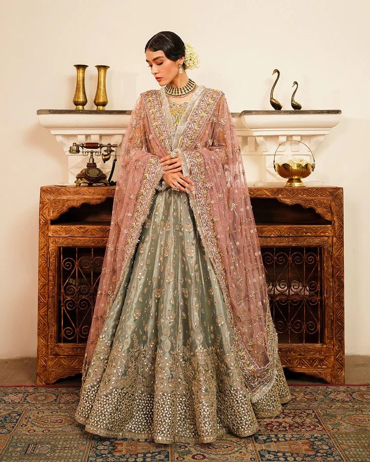 Model wearing Faiza Saqlain Formals Irina Oct '23 Najmeh dress in pastel green, yellow and blush pink, showcasing tradtional Pakistani clothes online in UK.