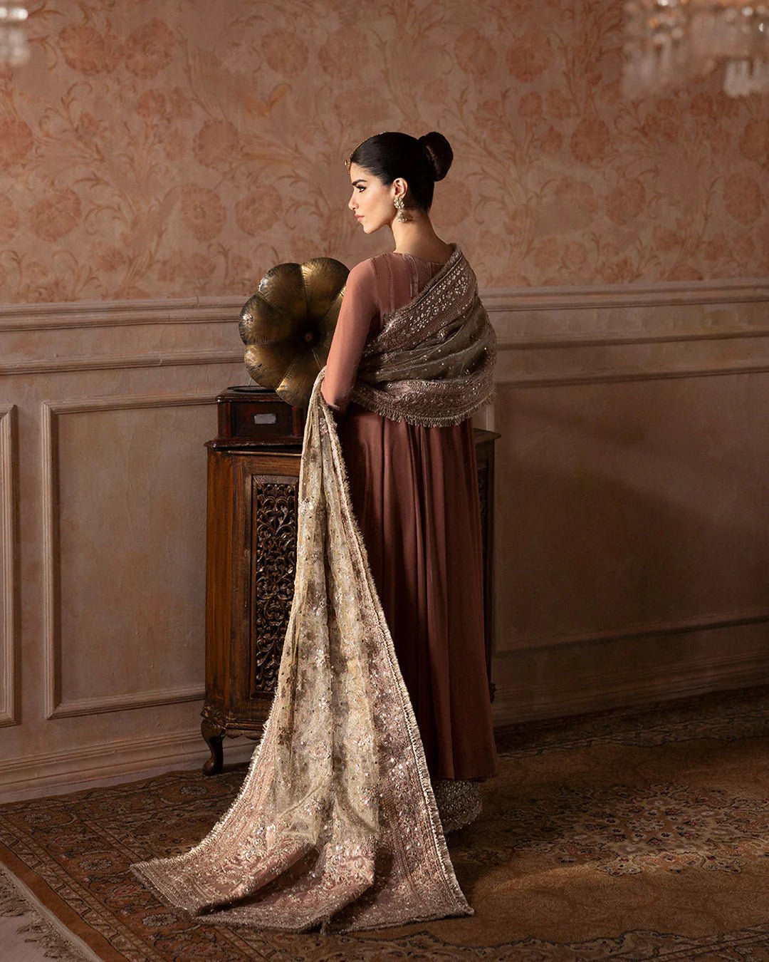 Model wearing Faiza Saqlain Ismene Averna dress in dusty rose with intricate silver embroidery and embellished dupatta. Shop Pakistani bridal dresses online in the UK now.