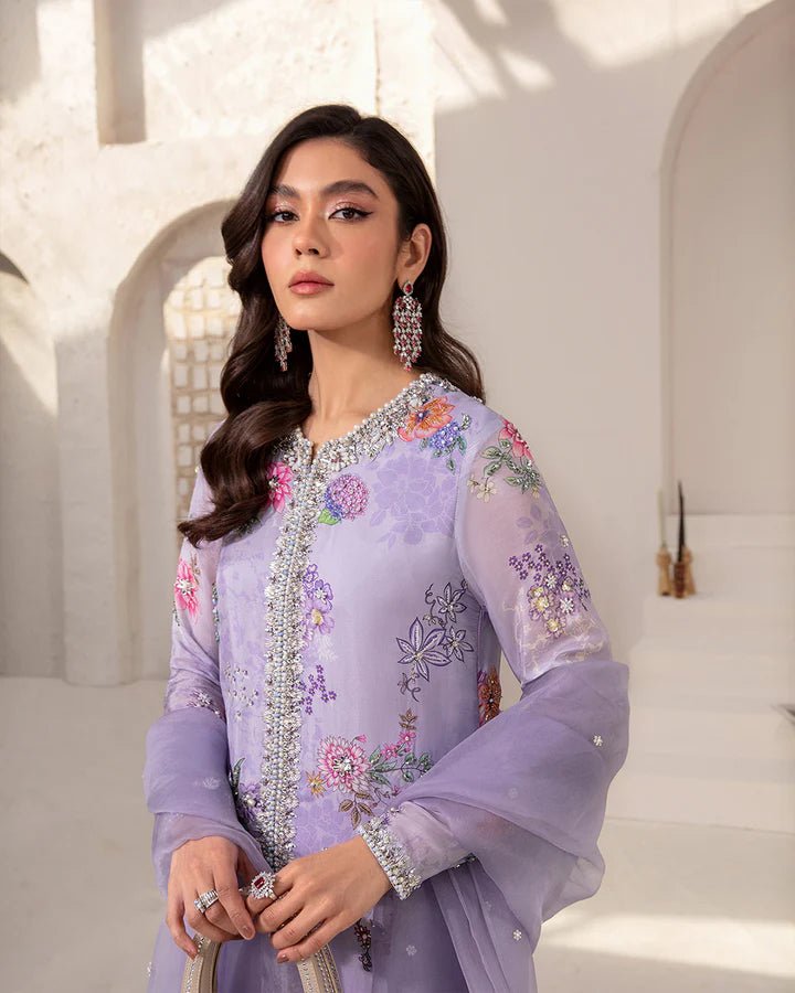 Model wearing a lavender Aria dress with intricate floral embroidery from Faiza Saqlain's Lenora Luxury Pret '24 collection. Pakistani clothes online in UK.