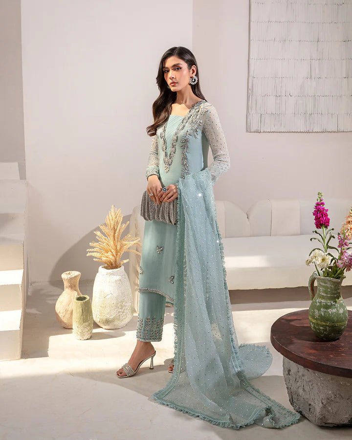 model wearing Faiza Saqlain Arleena, beaded aqua Pakistani wedding dress in UK