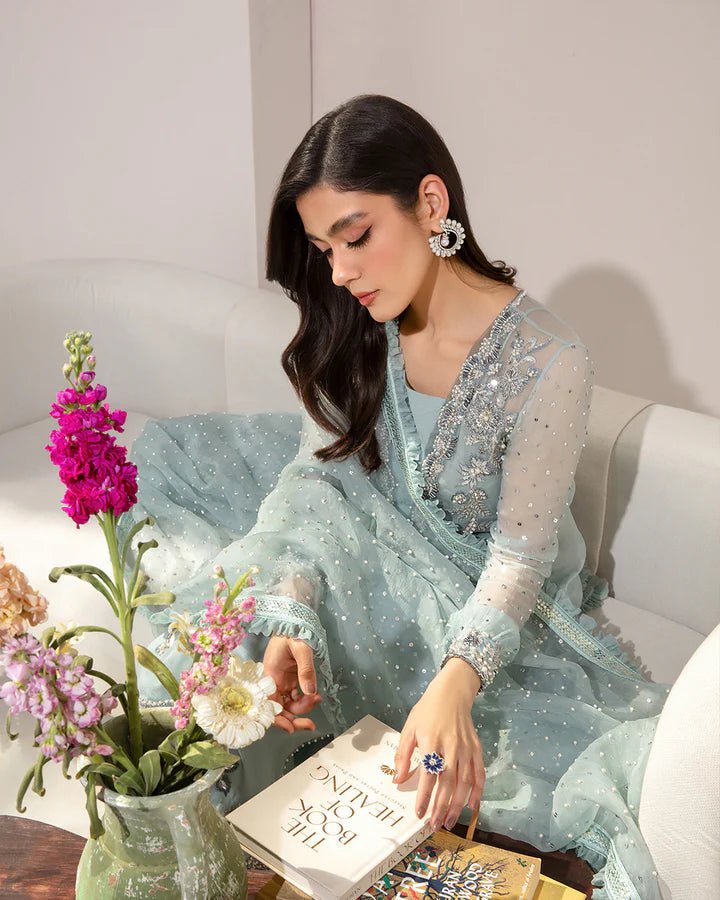 Model wearing a pastel blue Myria dress from Faiza Saqlain's Lenora Luxury Pret '24 collection. Pakistani clothes online in UK.