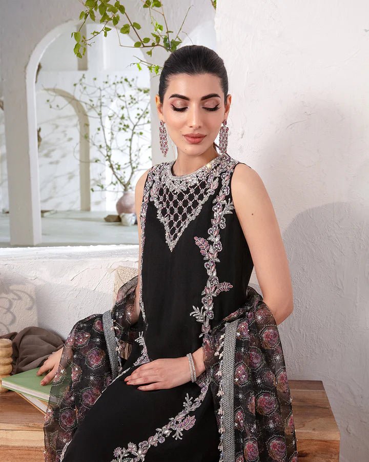 Model wearing a black Cherine dress from Faiza Saqlain's Lenora Luxury Pret '24 collection. Pakistani clothes online in UK.