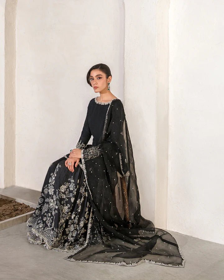 Model wearing a black Ciar dress from Faiza Saqlain's Lenora Luxury Pret '24 collection. Pakistani clothes online in UK.