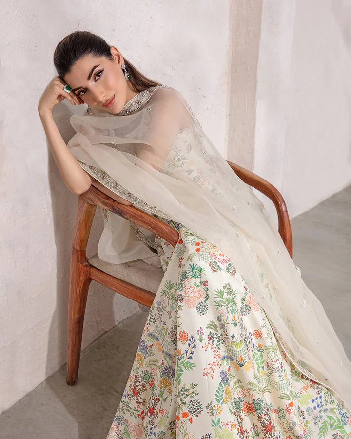 model wearing Faiza Saqlain Floretta with floral embroidery, Pakistani wedding dress in UK