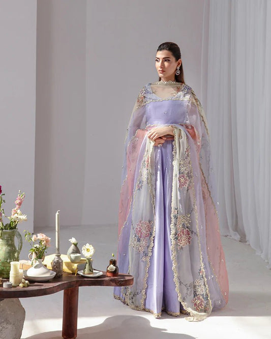 model wearing Faiza Saqlain Keva, embellished lilac Pakistani wedding dress in UK