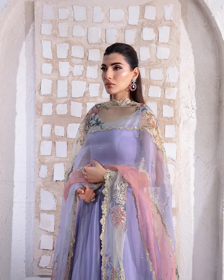 Model wearing a pastel lavender and peach Keva dress from Faiza Saqlain's Lenora Luxury Pret '24 collection. Pakistani clothes online in UK.