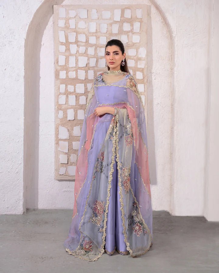 Model wearing a pastel lavender and peach Keva dress from Faiza Saqlain's Lenora Luxury Pret '24 collection. Pakistani clothes online in UK.