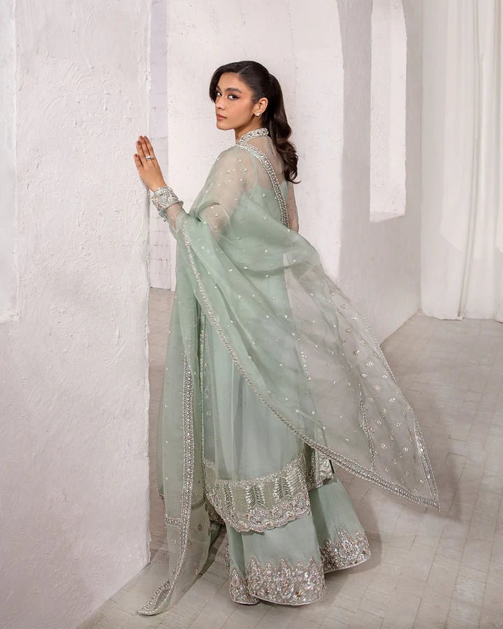 Model wearing a mint green Marvela dress from Faiza Saqlain's Lenora Luxury Pret '24 collection. Pakistani clothes online in UK.