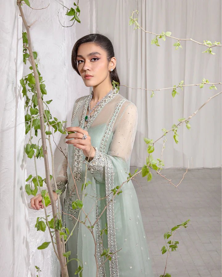 Model wearing a mint green Marvela dress from Faiza Saqlain's Lenora Luxury Pret '24 collection. Pakistani clothes online in UK.