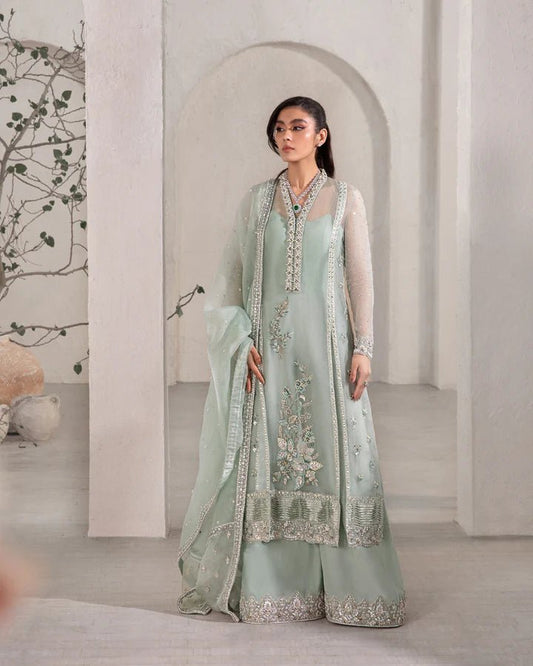 model wearing sea green Faiza Saqlain Marvela with silver embellishments, Pakistani wedding dress in UK