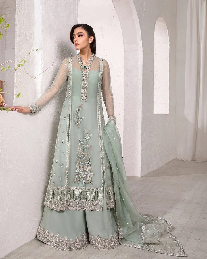 Model wearing a mint green Marvela dress from Faiza Saqlain's Lenora Luxury Pret '24 collection. Pakistani clothes online in UK.