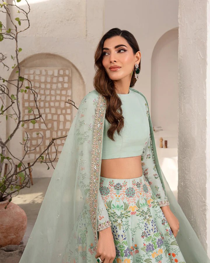 Model wearing a mint green Myria dress with floral embroidery from Faiza Saqlain's Lenora Luxury Pret '24 collection. Pakistani clothes online in UK.