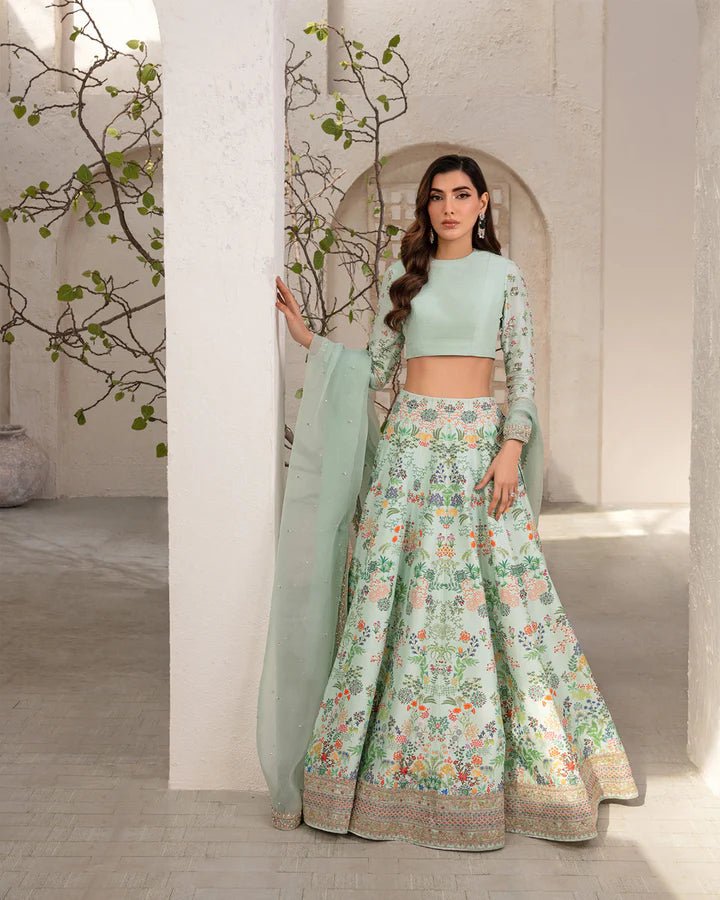 Model wearing a mint green Myria dress with floral embroidery from Faiza Saqlain's Lenora Luxury Pret '24 collection. Pakistani clothes online in UK.