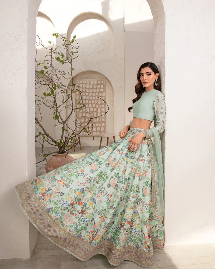 Model wearing a mint green Myria dress with floral embroidery from Faiza Saqlain's Lenora Luxury Pret '24 collection. Pakistani clothes online in UK.