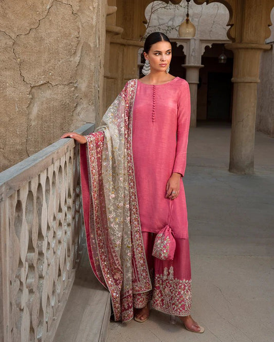 Model wearing a vibrant pink Hafa dress from Faiza Saqlain's Luxe Formals Laira collection, highlighting elegant Pakistani attire available online in the UK.