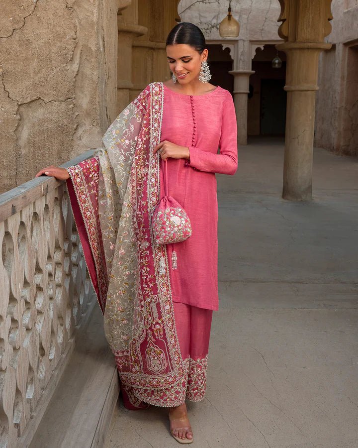 Model wearing a vibrant pink Hafa dress from Faiza Saqlain's Luxe Formals Laira collection, highlighting elegant Pakistani attire available online in the UK.