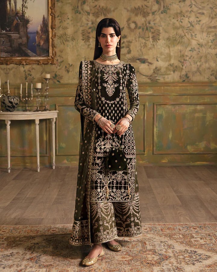 Model wearing a black Adara dress with gold embroidery from Faiza Saqlain's Luxe Formals Manaar Nov '23 collection. Pakistani clothes online in UK.