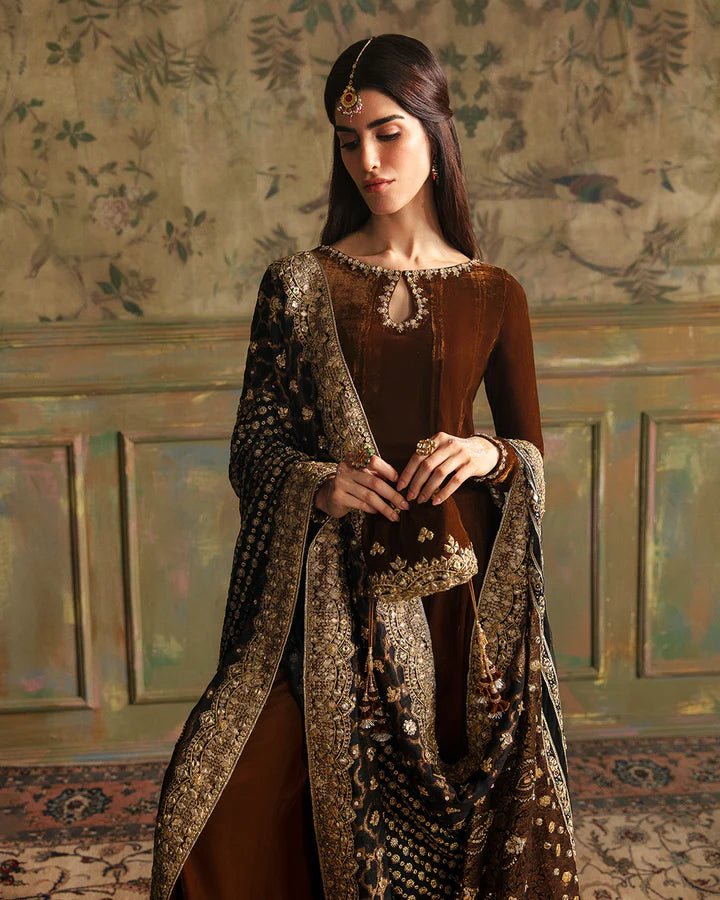 Model wearing Faiza Saqlain Luxe Formals Manaar Nov '23 Ritaan dress in maroon, Pakistani clothes online in UK.