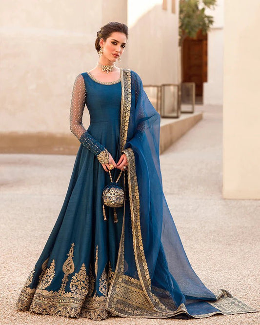 Model in Faiza Saqlain UK Risma dress, luxe Pakistani clothes UK, in royal blue from Noor e Chashm Feb '23.