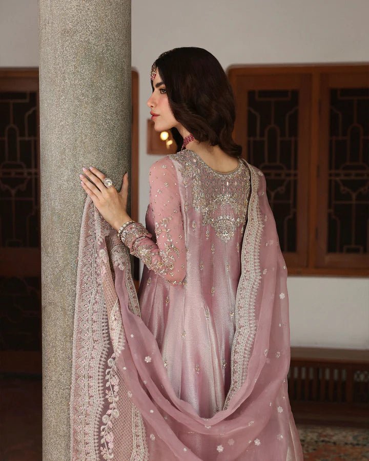 Model wearing a dusty rose Halina dress from Faiza Saqlain's Mehermah Luxe Formals '24. Perfect for Pakistani wedding clothes online in UK.