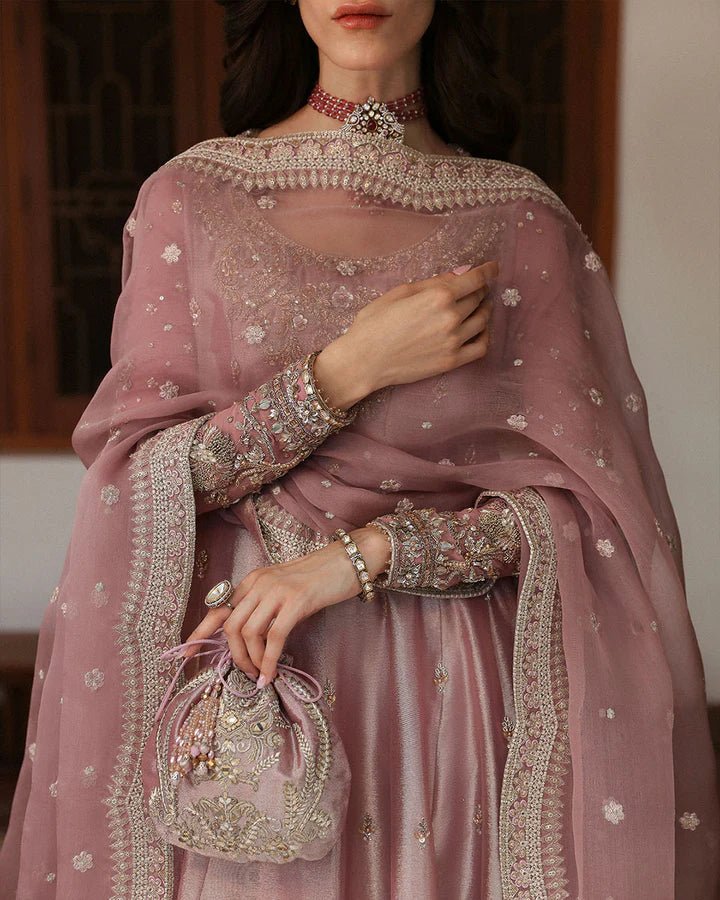 Model wearing a dusty rose Halina dress from Faiza Saqlain's Mehermah Luxe Formals '24. Perfect for Pakistani wedding clothes online in UK.