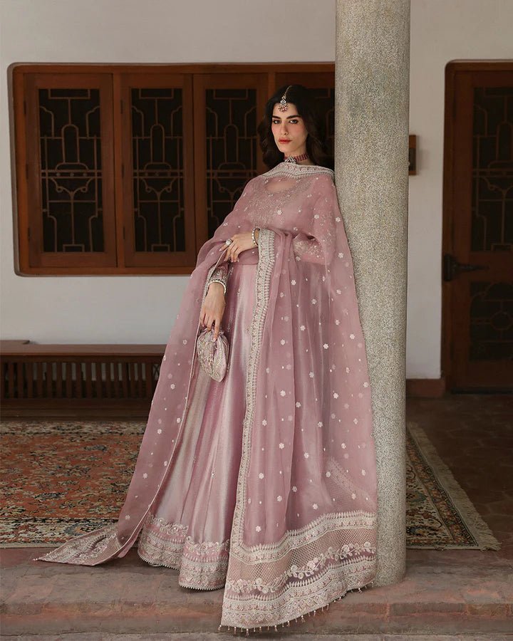 Model wearing a dusty rose Halina dress from Faiza Saqlain's Mehermah Luxe Formals '24. Perfect for Pakistani wedding clothes online in UK.