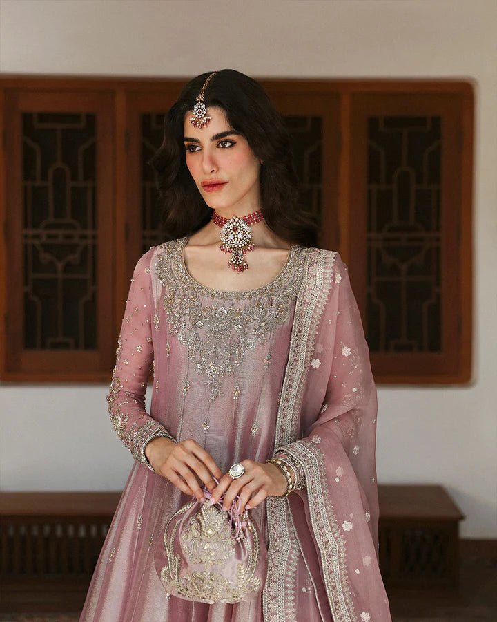 Model wearing a dusty rose Halina dress from Faiza Saqlain's Mehermah Luxe Formals '24. Perfect for Pakistani wedding clothes online in UK.