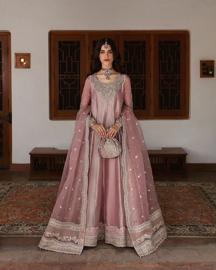 Model wearing a dusty rose Halina dress from Faiza Saqlain's Mehermah Luxe Formals '24. Perfect for Pakistani wedding clothes online in UK.