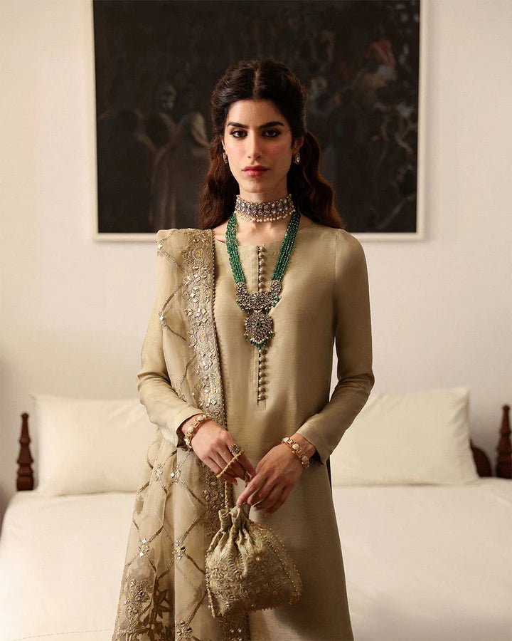 Model wearing a maroon Norine dress from Faiza Saqlain's Mehermah Luxe Formals '24. Highlighting Faiza Saqlain, Pakistani clothes online in UK, and wedding clothes.