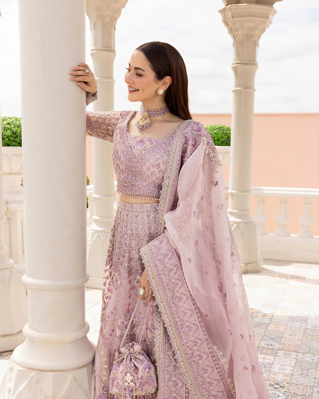 Model wearing Anysia from Faiza Saqlain's Neorah Wedding Festive '24 in stunning colors. Pakistani wedding clothes online in UK at Signature Labels