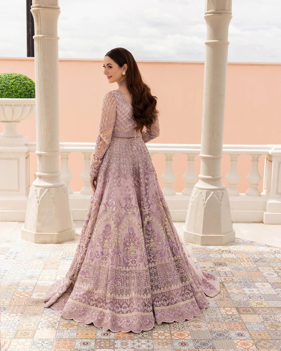 Model wearing Anysia from Faiza Saqlain's Neorah Wedding Festive '24 in stunning colors. Pakistani wedding clothes online in UK at Signature Labels