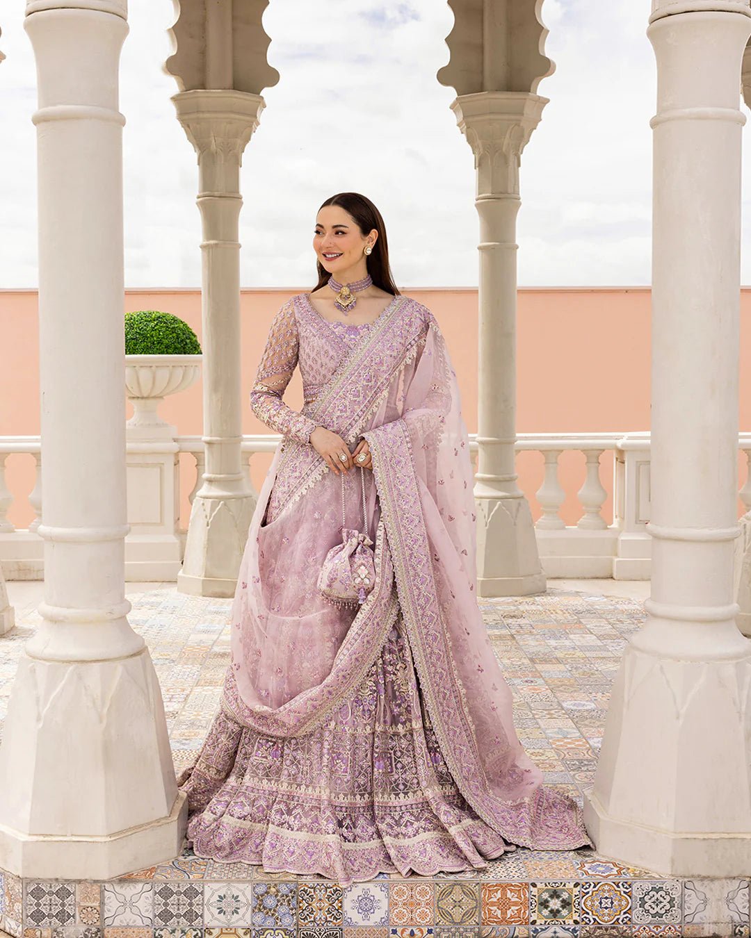 Model wearing Anysia from Faiza Saqlain's Neorah Wedding Festive '24 in stunning colors. Pakistani wedding clothes online in UK at Signature Labels