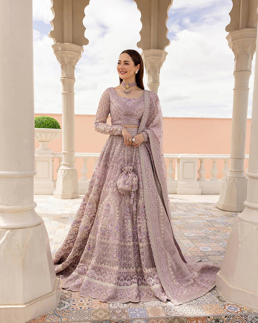 Model wearing Anysia from Faiza Saqlain's Neorah Wedding Festive '24 in stunning colors. Pakistani wedding clothes online in UK at Signature Labels