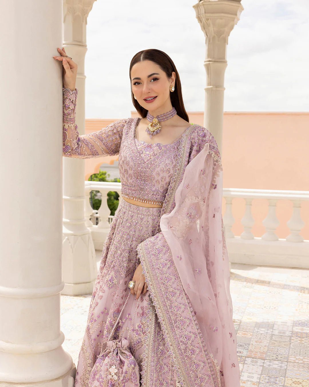 Model wearing Anysia from Faiza Saqlain's Neorah Wedding Festive '24 in stunning colors. Pakistani wedding clothes online in UK at Signature Labels