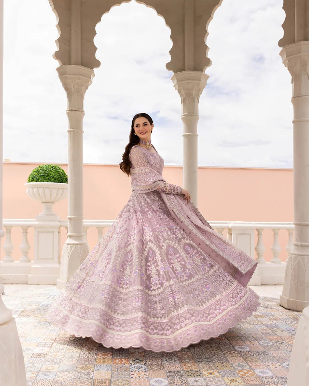 Model wearing Anysia from Faiza Saqlain's Neorah Wedding Festive '24 in stunning colors. Pakistani wedding clothes online in UK at Signature Labels