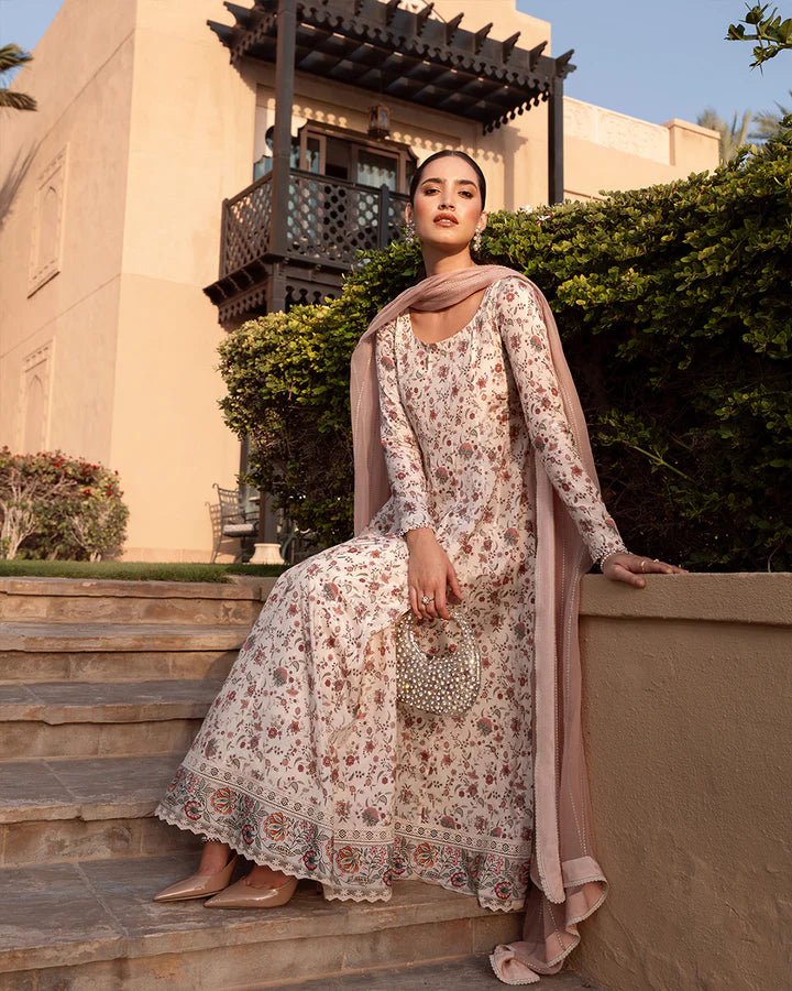 Model wearing cream floral Elysia dress from Faiza Saqlain's Zurina Luxe Silk Edit '24 collection. Pakistani clothes online in UK.