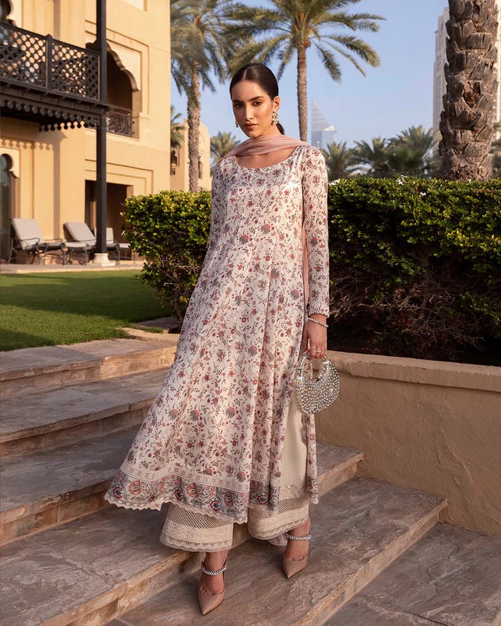 Model wearing cream floral Elysia dress from Faiza Saqlain's Zurina Luxe Silk Edit '24 collection. Pakistani clothes online in UK.