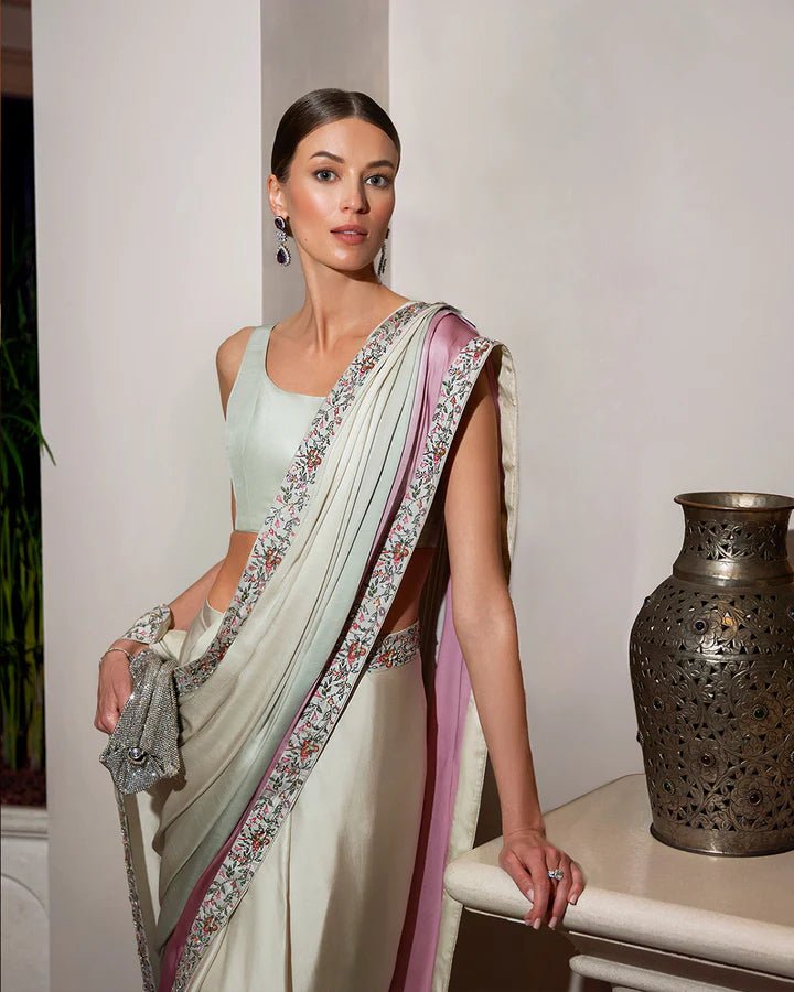 Model wearing an elegant pastel Lenci saree with floral embroidery from Faiza Saqlain's Zurina Luxe Silk Edit '24 collection. Pakistani clothes online in UK.