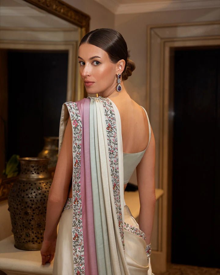 Model wearing an elegant pastel Lenci saree with floral embroidery from Faiza Saqlain's Zurina Luxe Silk Edit '24 collection. Pakistani clothes online in UK.