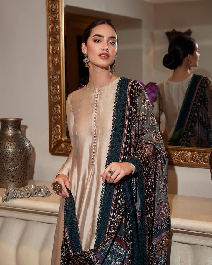 Model wearing a stylish beige Leora dress with a richly patterned shawl from Faiza Saqlain's Zurina Luxe Silk Edit '24 collection. Pakistani clothes online in UK.