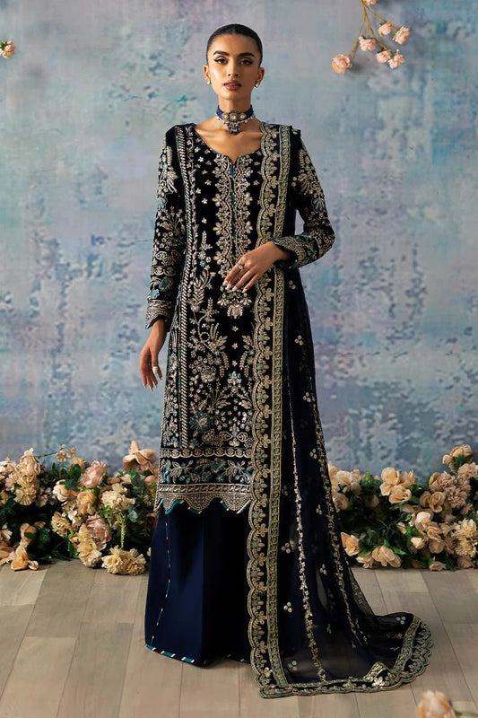 Model wearing Azure from Gulaal's Celeste Unstitched Velvet '24 collection in royal blue. Luxury pret, festive, Pakistani clothes online in UK.