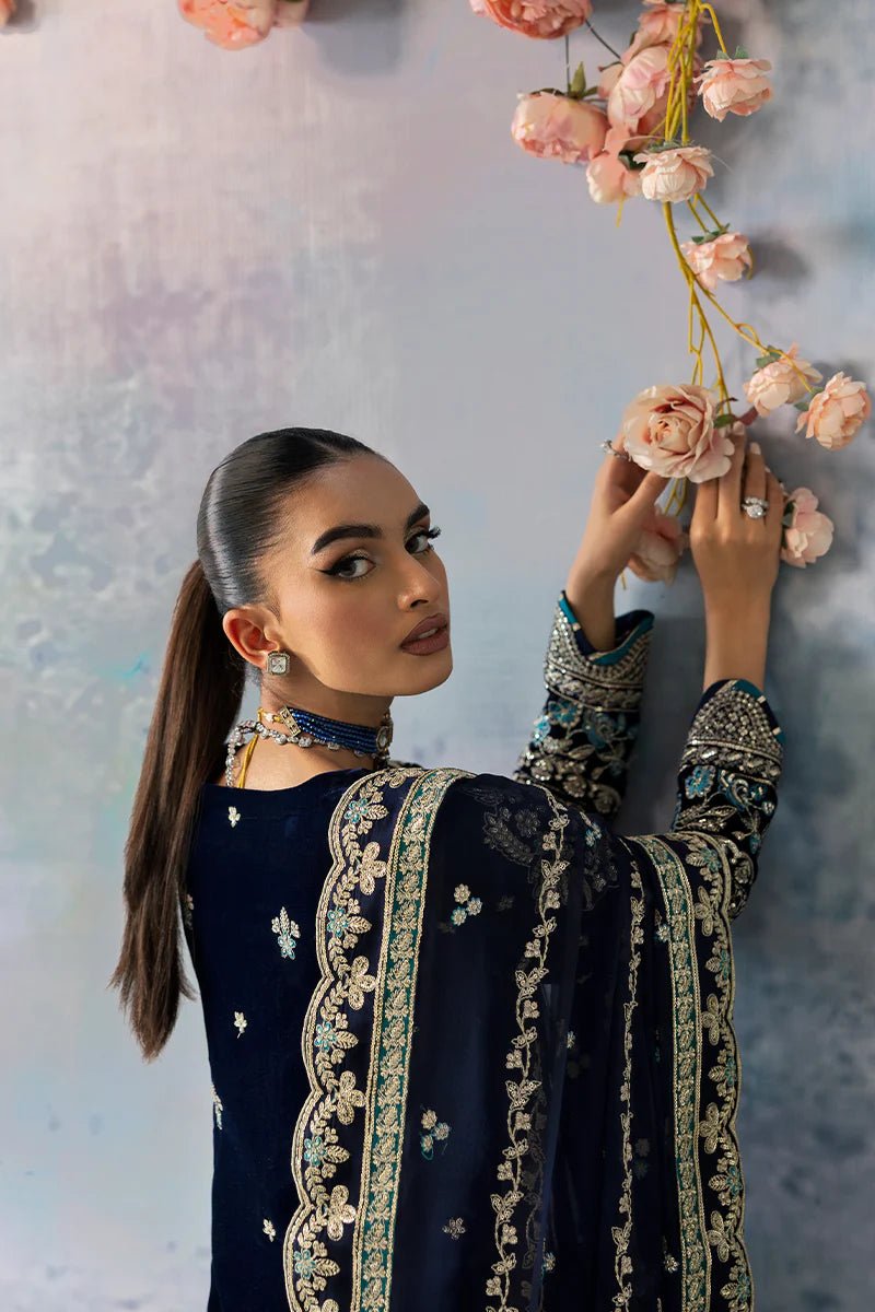 Model wearing Azure from Gulaal's Celeste Unstitched Velvet '24 collection in royal blue. Luxury pret, festive, Pakistani clothes online in UK.