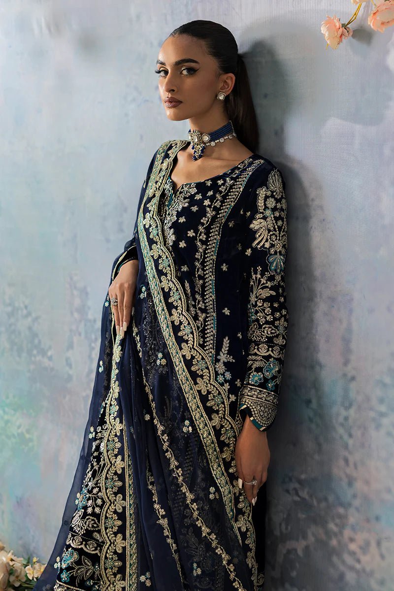 Model wearing Azure from Gulaal's Celeste Unstitched Velvet '24 collection in royal blue. Luxury pret, festive, Pakistani clothes online in UK.