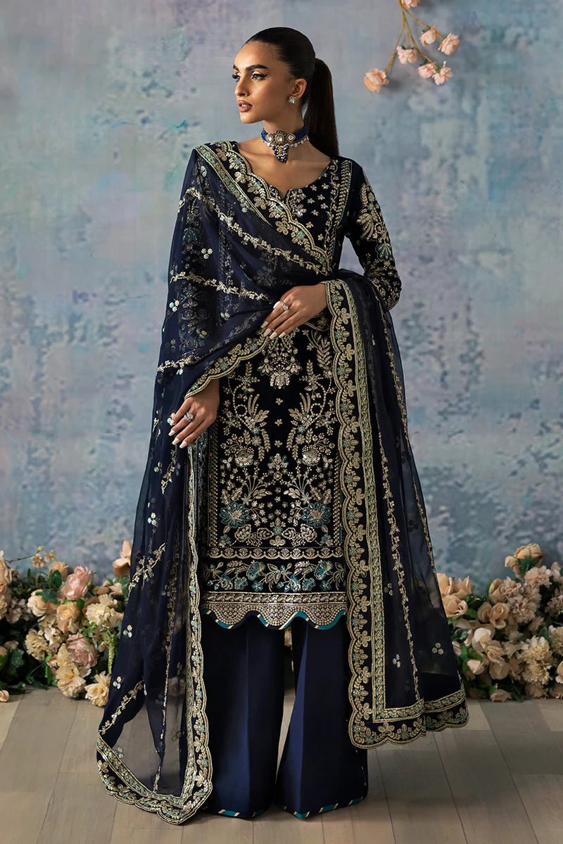 Model wearing Azure from Gulaal's Celeste Unstitched Velvet '24 collection in royal blue. Luxury pret, festive, Pakistani clothes online in UK.