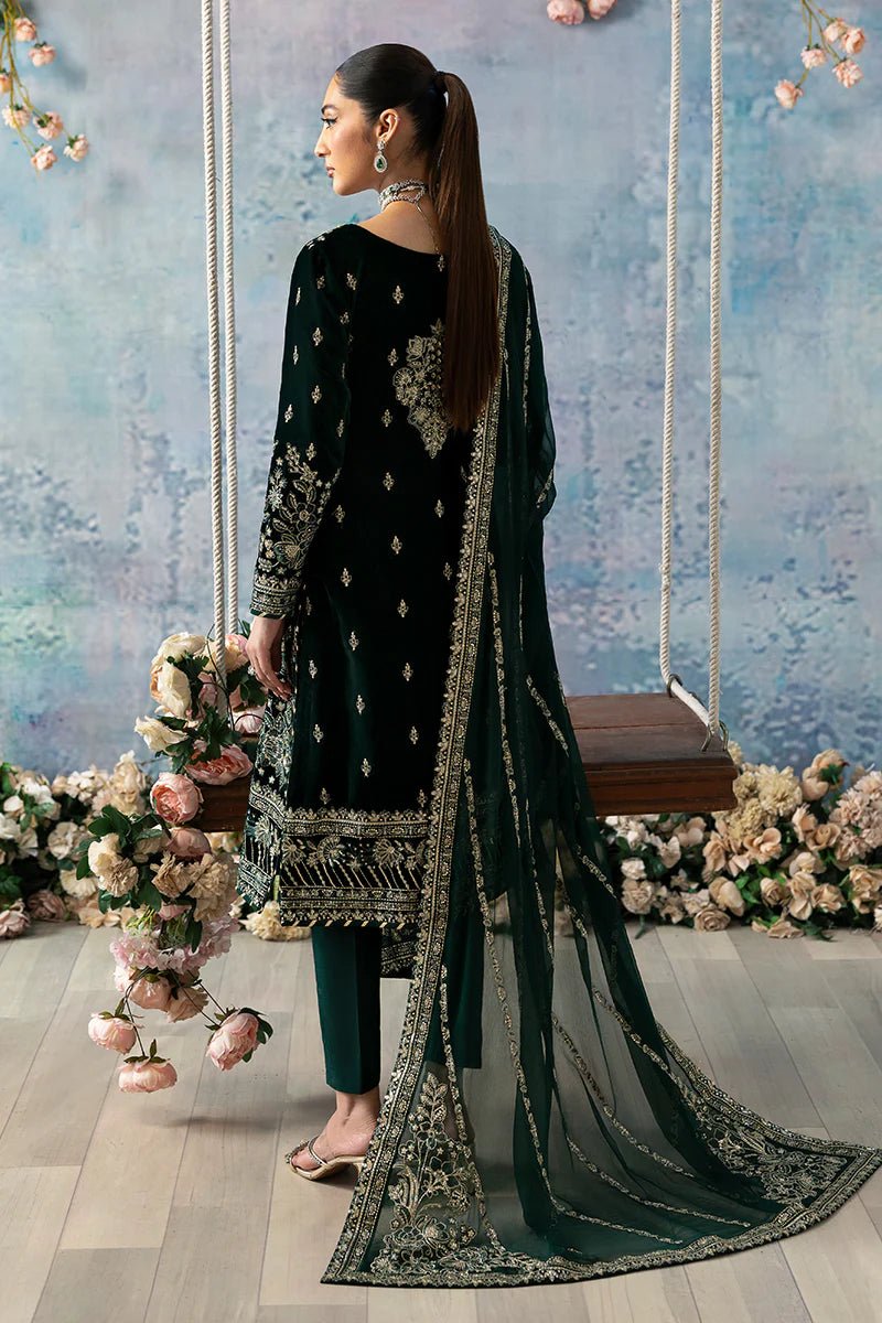 Model wearing Eden from Gulaal's Celeste Unstitched Velvet '24 collection in deep green. Luxury pret, festive, Pakistani clothes online in UK.