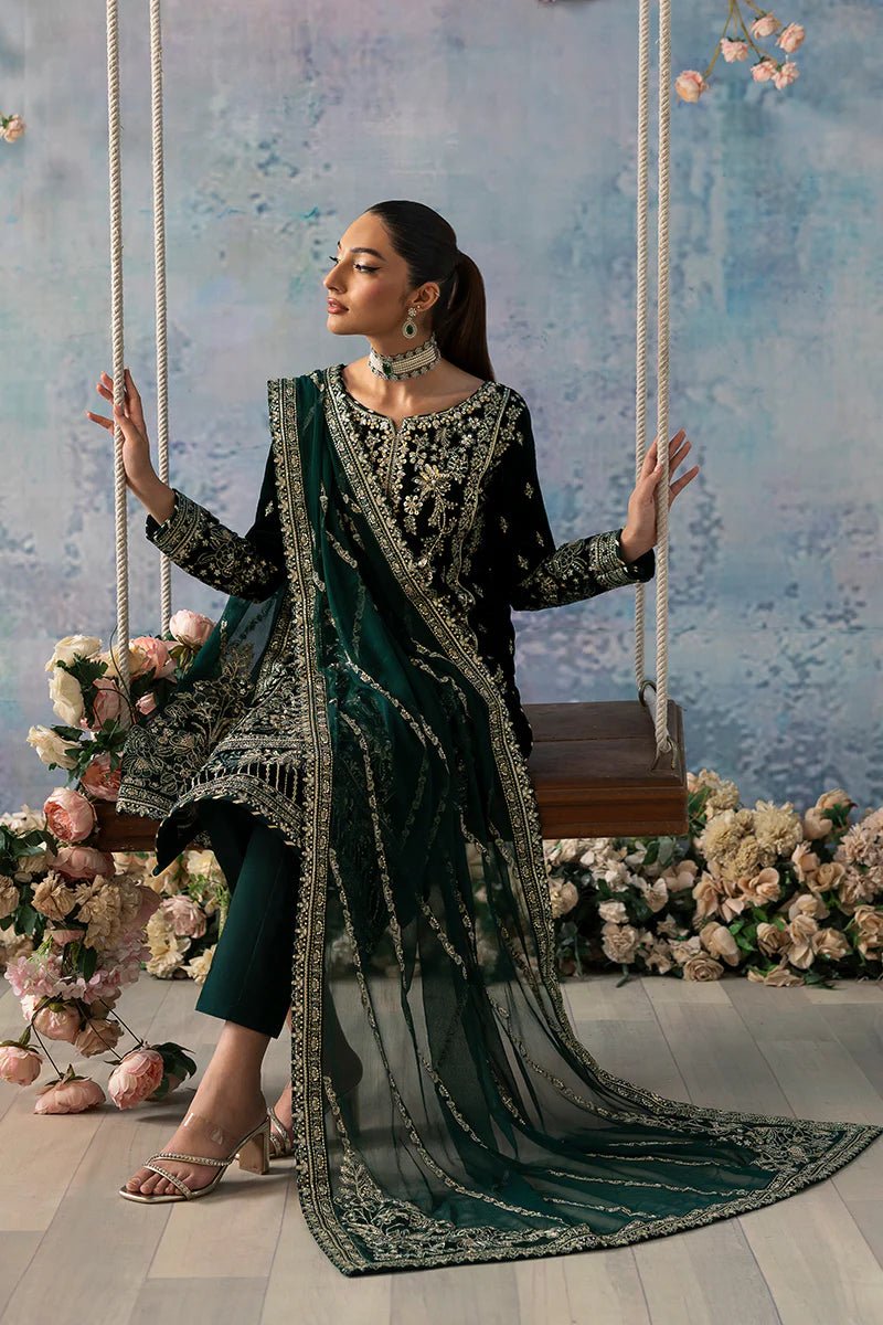 Model wearing Eden from Gulaal's Celeste Unstitched Velvet '24 collection in deep green. Luxury pret, festive, Pakistani clothes online in UK.