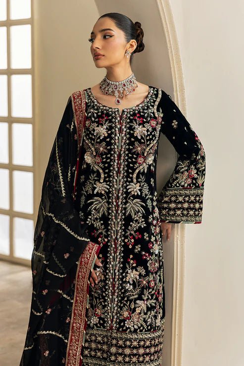 Model wearing Raven from Gulaal's Celeste Unstitched Velvet '24 collection in deep black. Luxury pret, festive, Pakistani clothes online in UK.