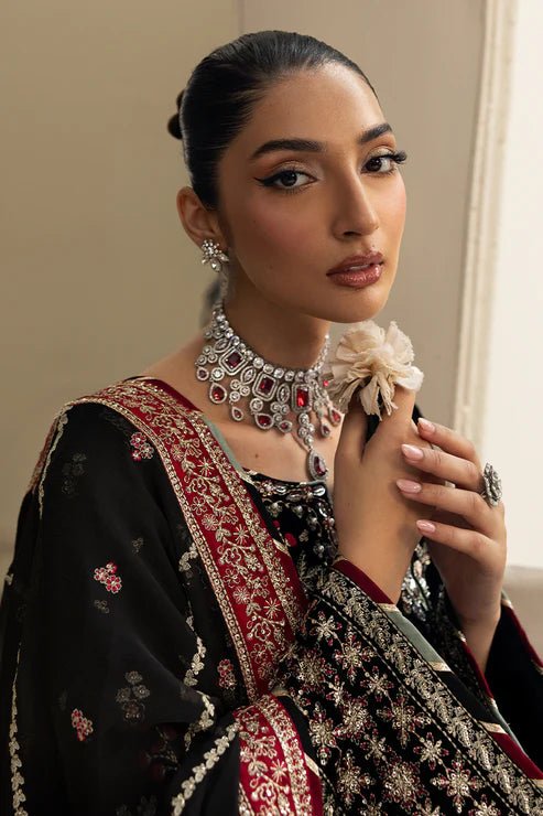 Model wearing Raven from Gulaal's Celeste Unstitched Velvet '24 collection in deep black. Luxury pret, festive, Pakistani clothes online in UK.